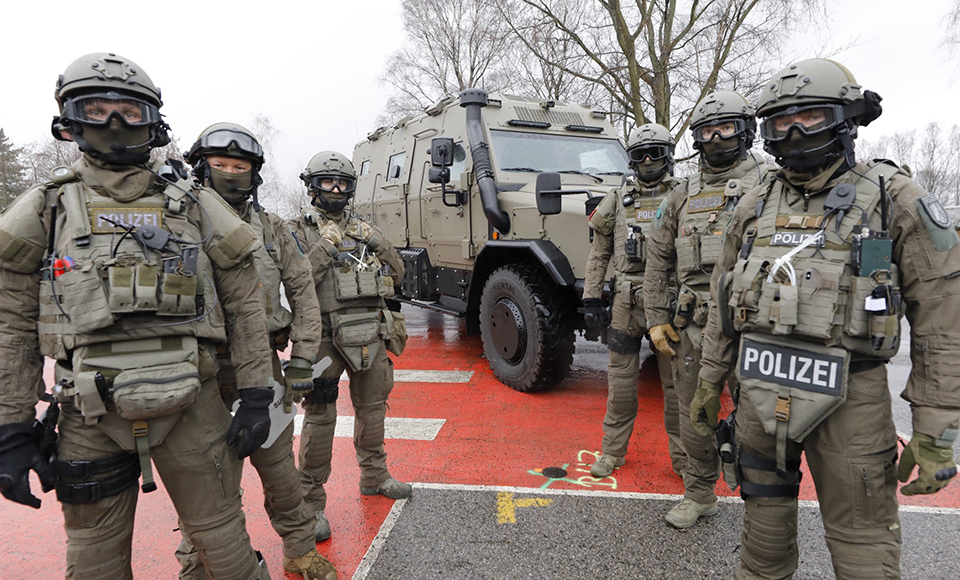 Special task force in front of the 'Survivor R' anti-terror vehicle