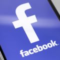 The Facebook app opens on a smartphone