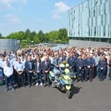 Employees of the Mettmann police force gather in a minute's silence