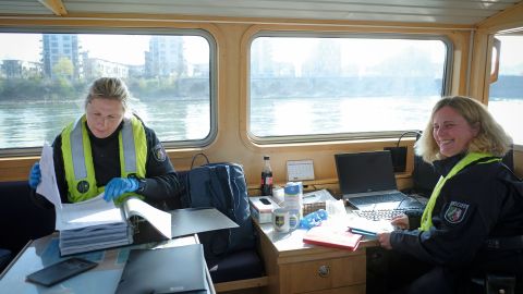 Policewomen from the WSP check the papers of a ship