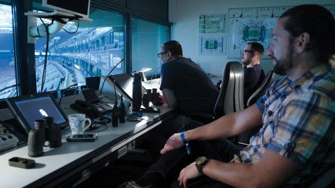 From their observation post in the Schalke Arena, the officers have a clear view of the empty stadium