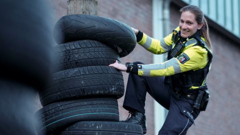 The more difficult, the better: even a sloping stack of tires doesn't stop Sarah Drees from climbing up it.